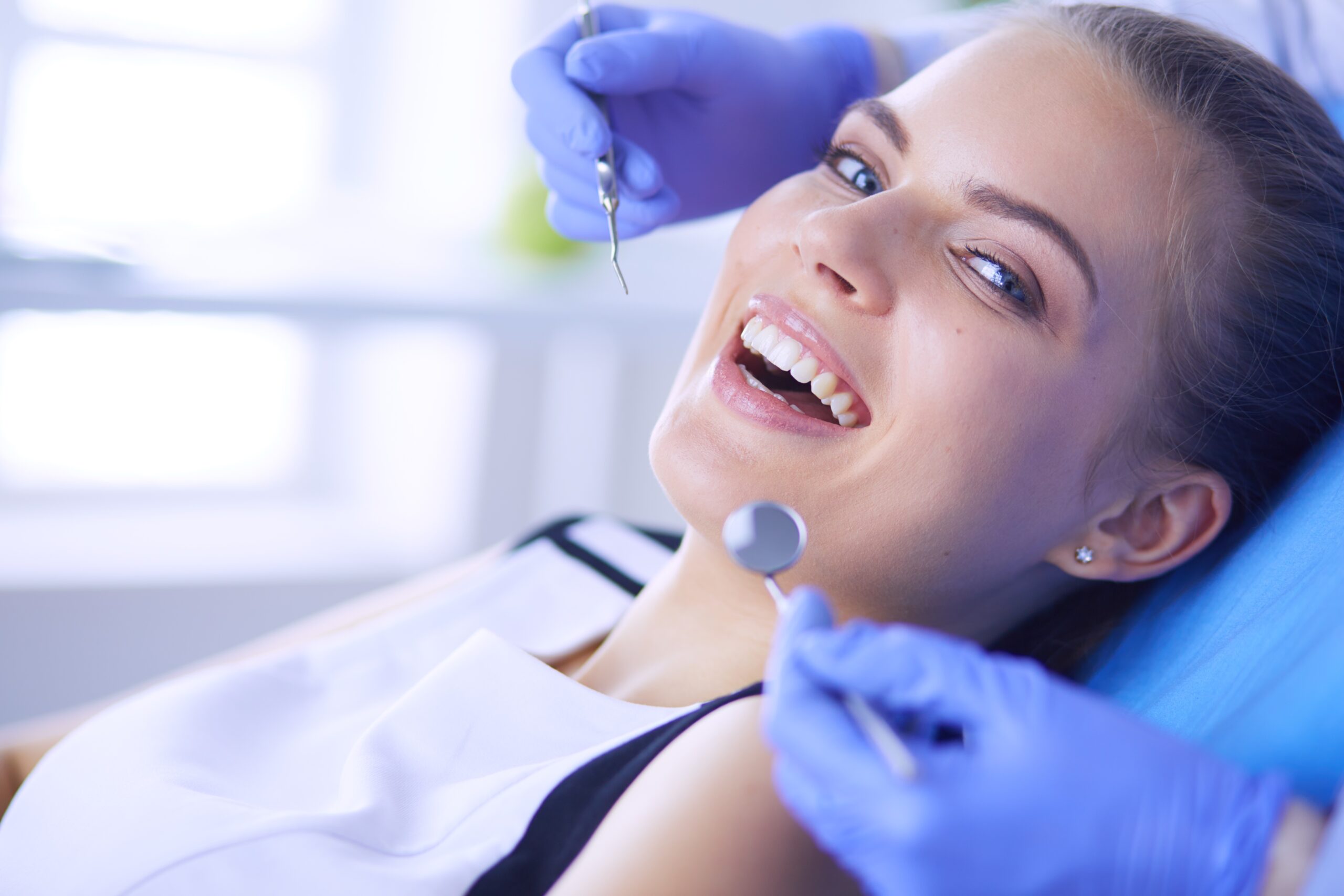 Woman doing a tooth procedure in Dentin Family Dentistry in Vaughan